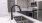 Renovated black matte gooseneck faucet in bright kitchen